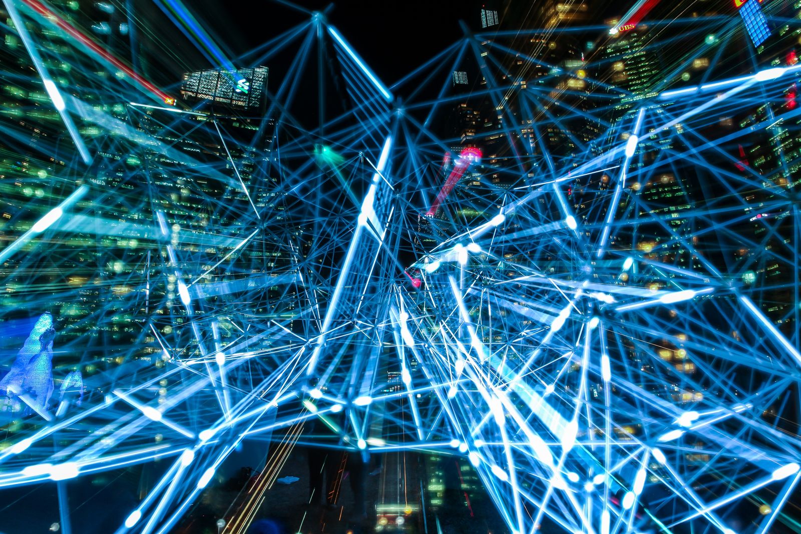 Abstract blue light trails forming an interconnected network pattern